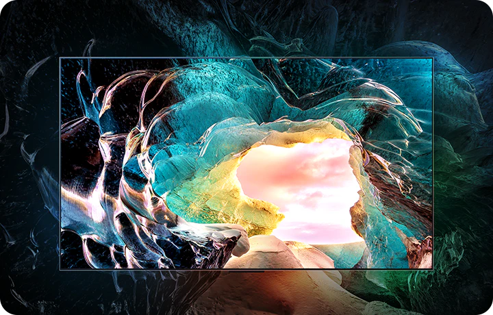 LG OLED M5 TV화면에서 밝고 화려한 색상의 추상적인 동굴 입구 이미지를 보여줍니다. 동굴 입구 너머로는 밝은 구름 낀 하늘이 보입니다. 화면 주변은 흐릿하고 어두운 배경으로 처리되어 화면에 표시된 이미지의 생생한 색상과 세부 묘사를 강조합니다.