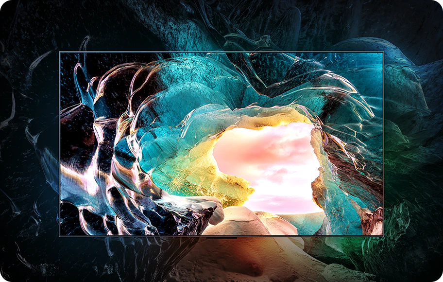LG OLED M5 TV화면에서 밝고 화려한 색상의 추상적인 동굴 입구 이미지를 보여줍니다. 동굴 입구 너머로는 밝은 구름 낀 하늘이 보입니다. 화면 주변은 흐릿하고 어두운 배경으로 처리되어 화면에 표시된 이미지의 생생한 색상과 세부 묘사를 강조합니다.